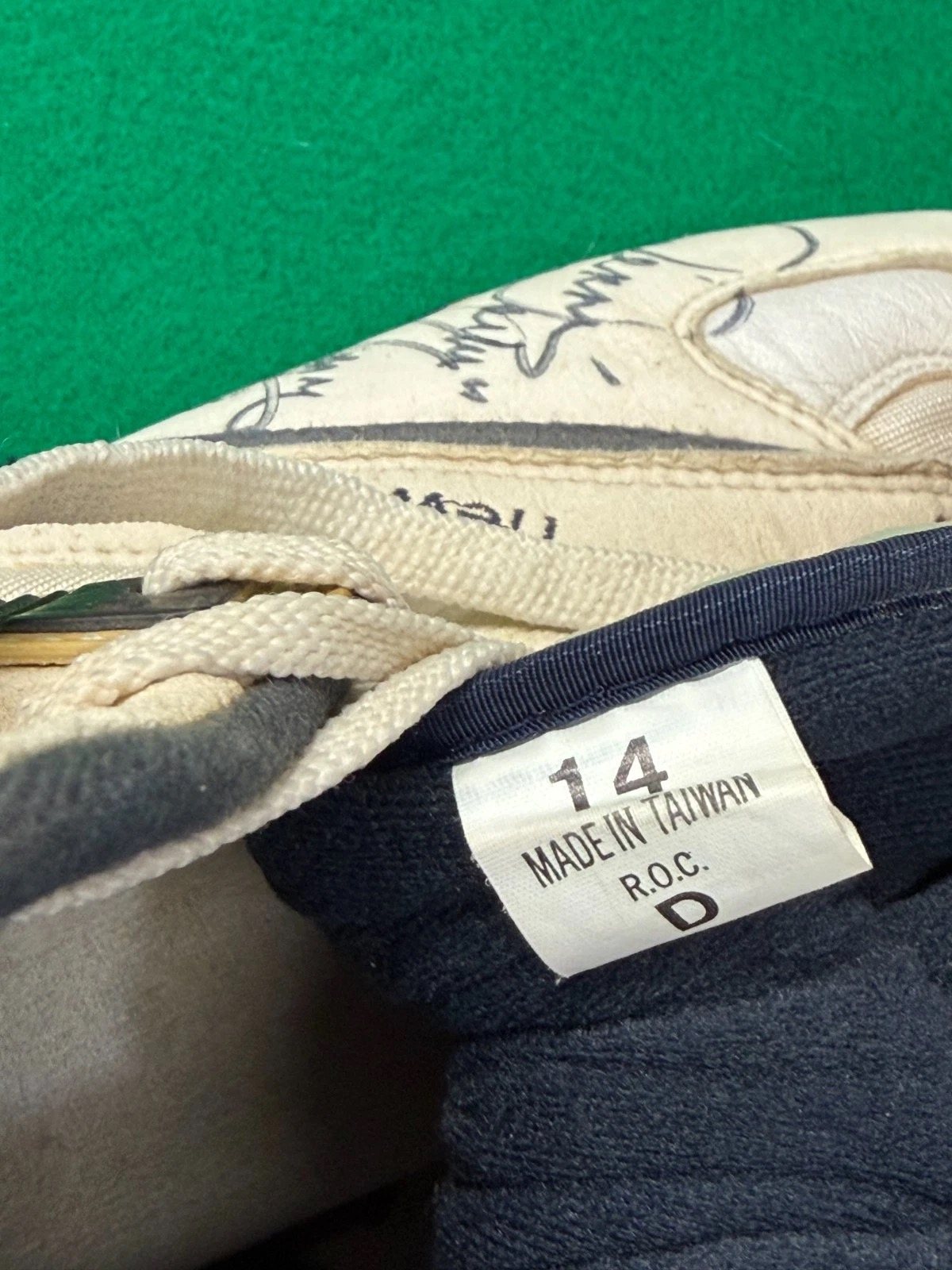 Inside tag of the shoe reading size 14
