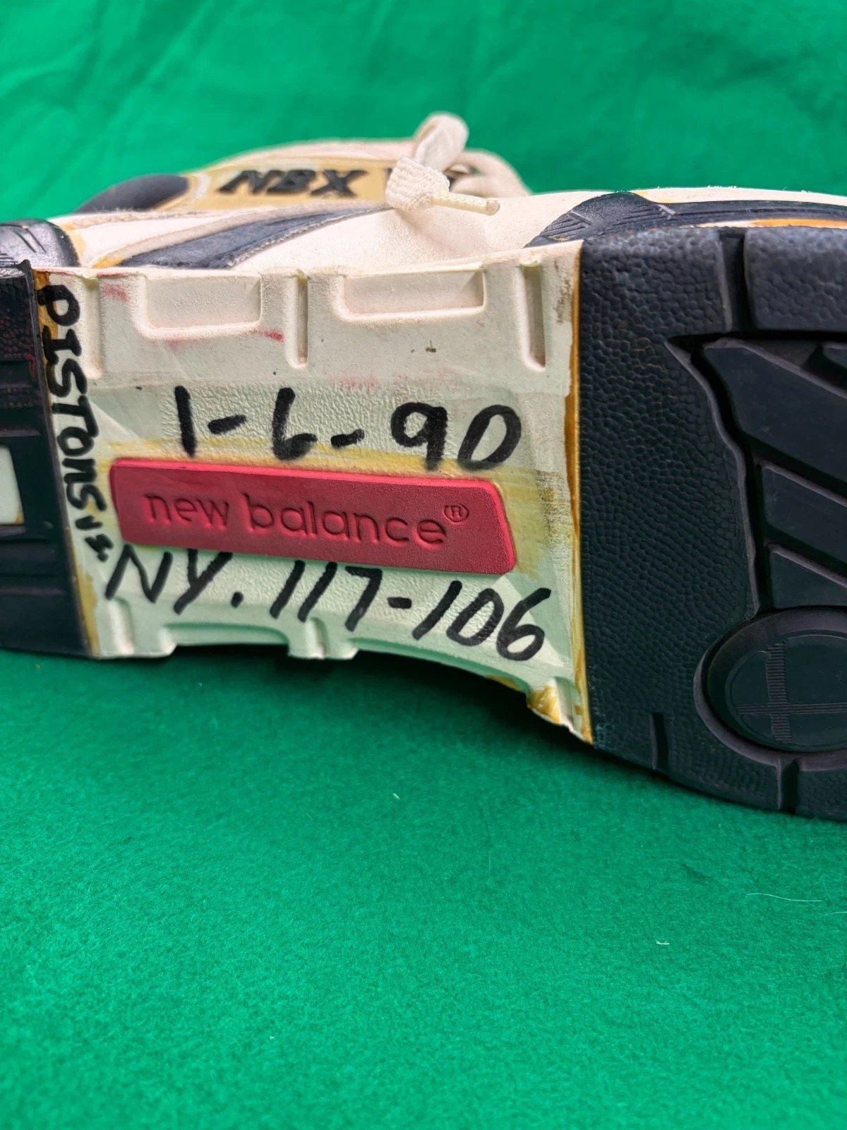 Both soles marked with the game date and score