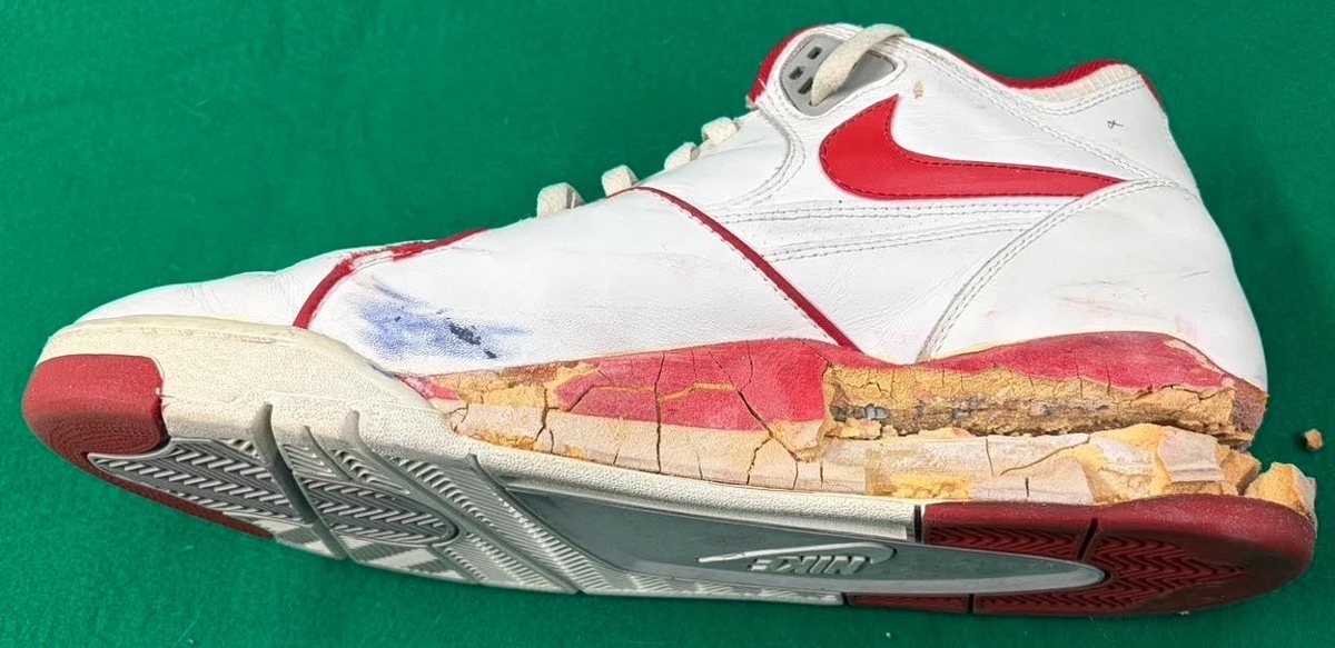 Underside of the sneaker showing the cracked, crumbling midsole