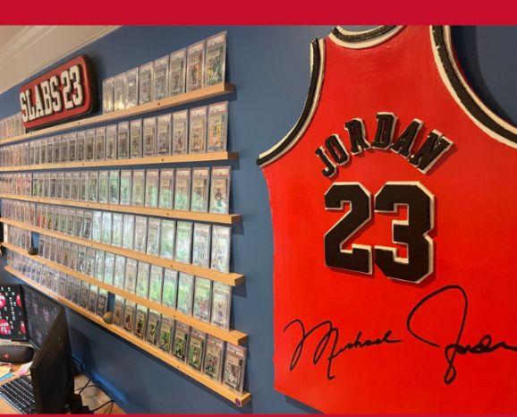 Wall of graded slabs beside a framed, signed Michael Jordan Bulls jersey