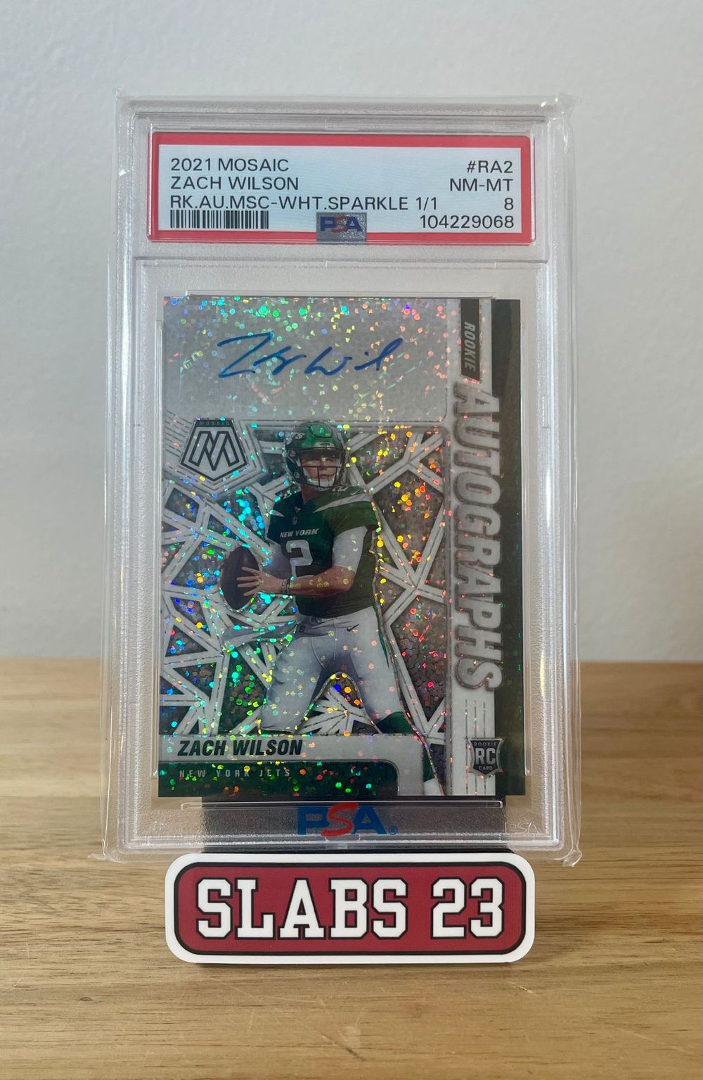 Zach Wilson 2021 Mosaic rookie autograph, White Sparkle 1/1 parallel, PSA 8 NM-MT, on a Slabs 23 stand